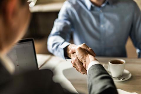 Two people shaking hands